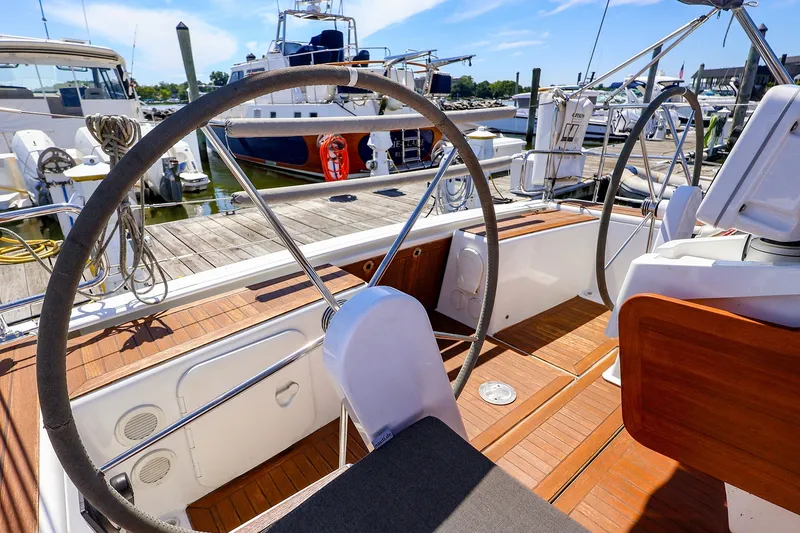 Slide: The Image of Cockpit of 2016 Hanse 385 yacht with dual steering wheels at marina. - 62