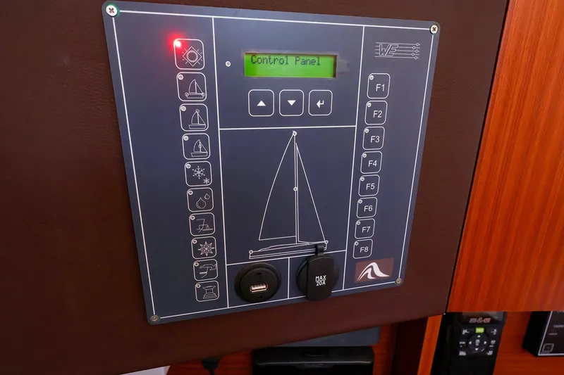 Slide: The Image of Control panel of a 2016 Hanse 385 yacht with various function buttons. - 36