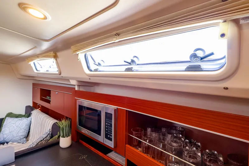 Slide: The Image of Interior of 2016 Hanse 385 yacht with modern kitchen and cozy seating area. - 40
