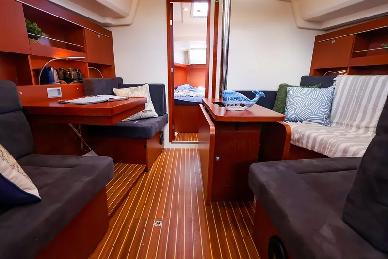 Slide: The Image of Interior of 2016 Hanse 385 yacht with cozy seating and wooden flooring. - 23