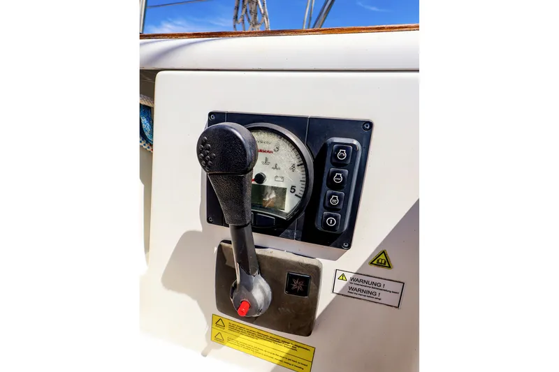 Slide: The Image of Control panel of a 2016 Hanse 385 sailboat with throttle and gauge. - 57
