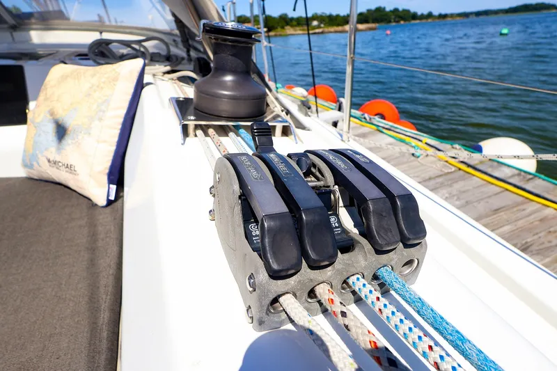 Slide: The Image of Deck of 2016 Hanse 385 sailboat with winch and ropes by the water. - 60