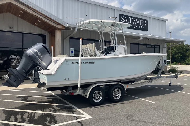 Slide: The Image of 2023 Sportsman Open 232 Center Console boat on trailer outside Saltwater Outfitters. - 6