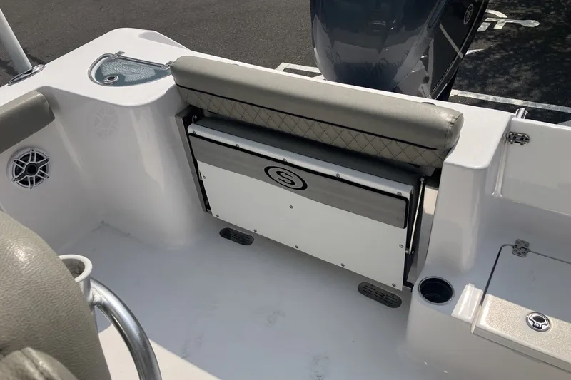 Slide: The Image of 2023 Sportsman Open 232 Center Console boat interior with seating and storage features. - 16