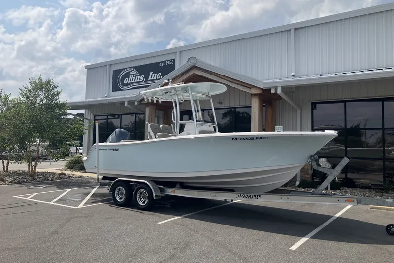 Slide: The Image of 2023 Sportsman Open 232 Center Console boat on trailer outside Collins, Inc. dealership. - 5