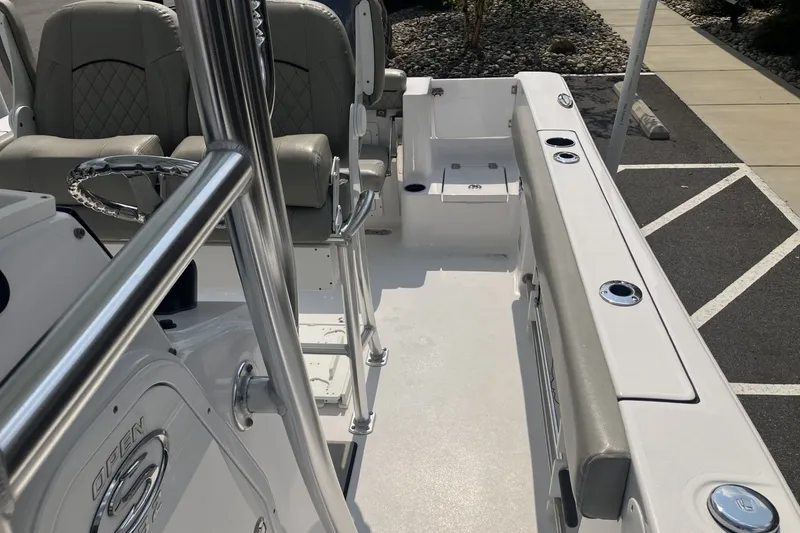 Slide: The Image of 2023 Sportsman Open 232 Center Console boat interior with seating and steering wheel. - 13