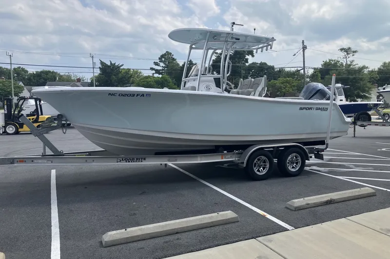 Slide: The Image of 2023 Sportsman Open 232 Center Console boat on trailer in parking lot. - 9