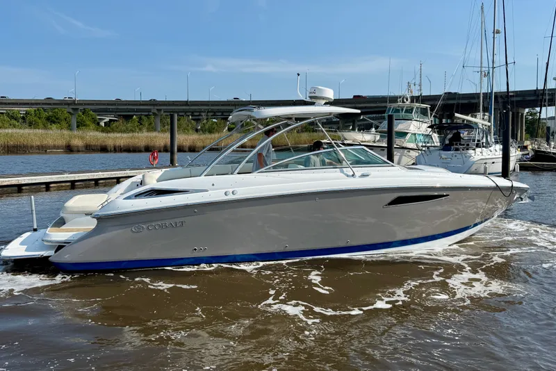 The Image of 2018 Cobalt R35 boat docked in marina, clear sky, calm water. - 0