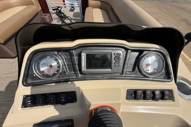 Slide: The Image of Dashboard of 2021 Godfrey Sweetwater 2286 FS boat with gauges and Lowrance display. - 43