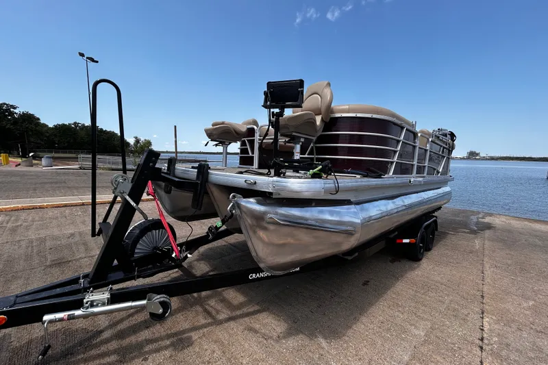 Slide: The Image of 2021 Godfrey Sweetwater 2286 FS pontoon boat on trailer by the water. - 71