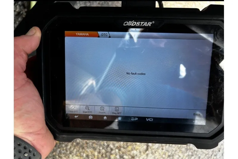 Slide: The Image of Hand holding diagnostic device displaying "No fault codes" on screen. - 68