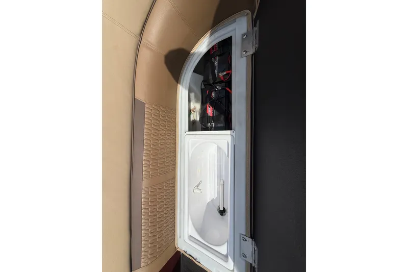 Slide: The Image of Storage compartment in 2021 Godfrey Sweetwater 2286 FS boat, featuring organized interior. - 35