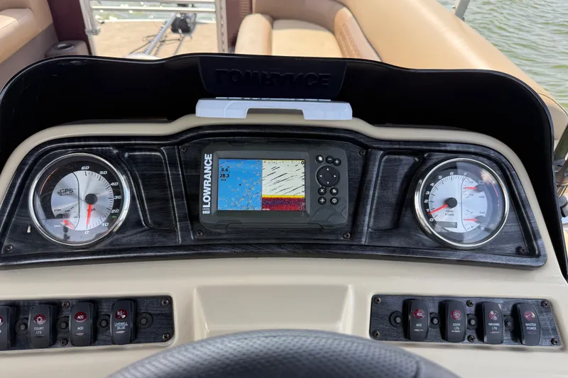 Slide: The Image of Dashboard of 2021 Godfrey Sweetwater 2286 FS with Lowrance display and gauges. - 62