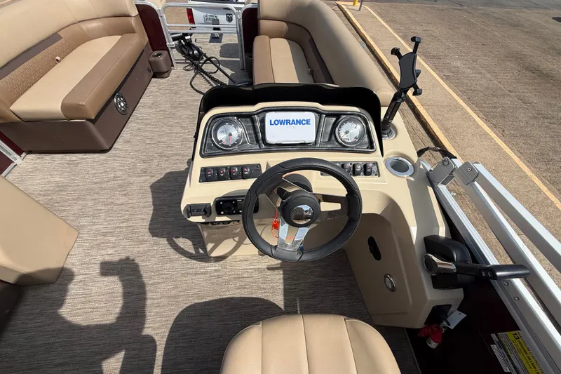 Slide: The Image of 2021 Godfrey Sweetwater 2286 FS boat interior with steering wheel and control panel. - 42