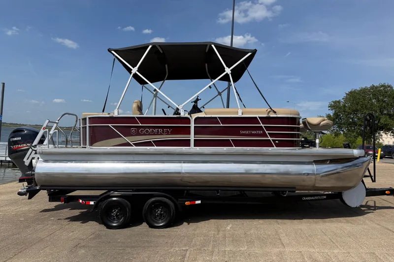 Slide: The Image of 2021 Godfrey Sweetwater 2286 FS pontoon boat on trailer, featuring Yamaha outboard motor. - 46