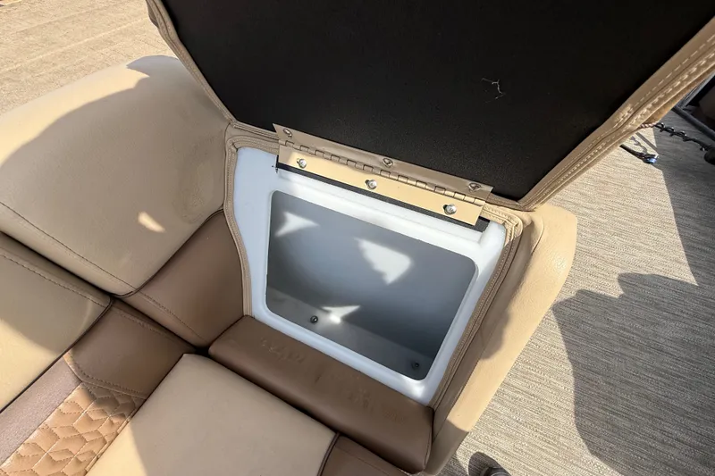 Slide: The Image of Open storage compartment in 2021 Godfrey Sweetwater 2286 FS boat seat. - 41