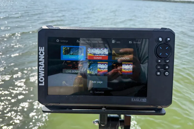Slide: The Image of Lowrance sonar display on 2021 Godfrey Sweetwater 2286 FS boat, showing chart and sonar options. - 57