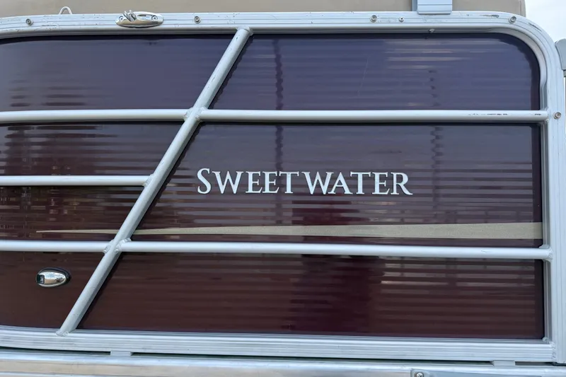 Slide: The Image of 2021 Godfrey Sweetwater 2286 FS pontoon boat with maroon paneling and white lettering. - 25