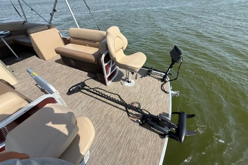 Slide: The Image of 2021 Godfrey Sweetwater 2286 FS pontoon boat with fishing setup on a lake. - 61