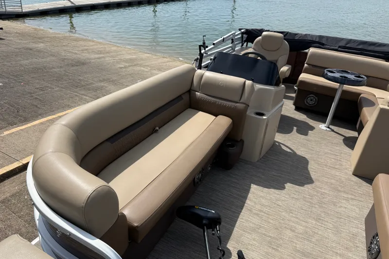 Slide: The Image of 2021 Godfrey Sweetwater 2286 FS pontoon boat interior with beige seating and steering console. - 36