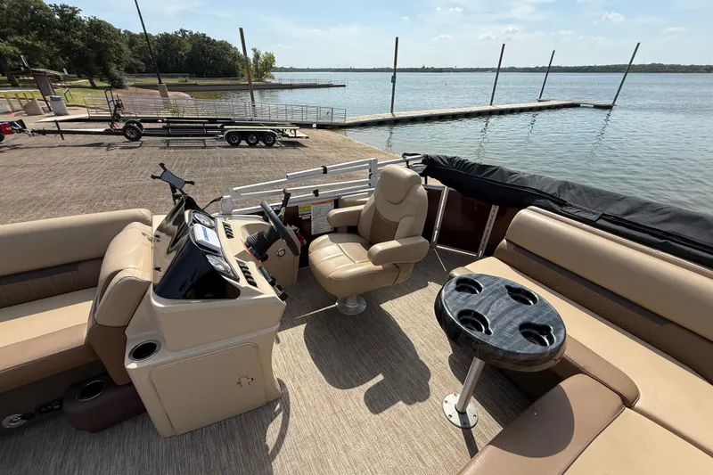 Slide: The Image of 2021 Godfrey Sweetwater 2286 FS pontoon boat interior at lakeside dock. - 39