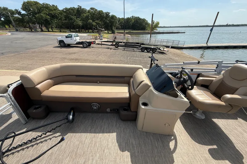 Slide: The Image of 2021 Godfrey Sweetwater 2286 FS pontoon boat interior at lakeside dock. - 37