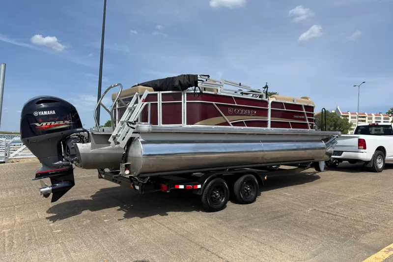 Slide: The Image of 2021 Godfrey Sweetwater 2286 FS pontoon boat on trailer, Yamaha engine, sunny day. - 17