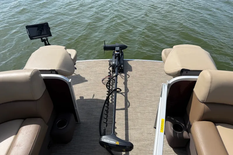 Slide: The Image of 2021 Godfrey Sweetwater 2286 FS boat deck with seating and fishing equipment. - 53