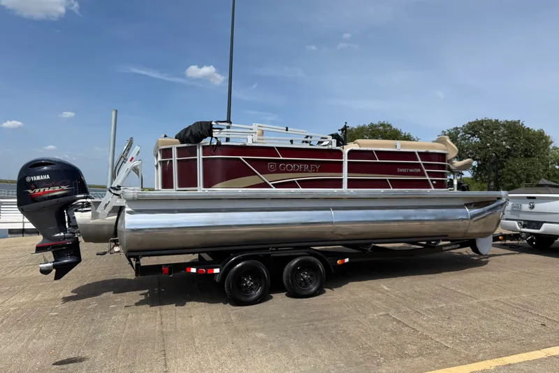 Slide: The Image of 2021 Godfrey Sweetwater 2286 FS pontoon boat on trailer with Yamaha outboard motor. - 16