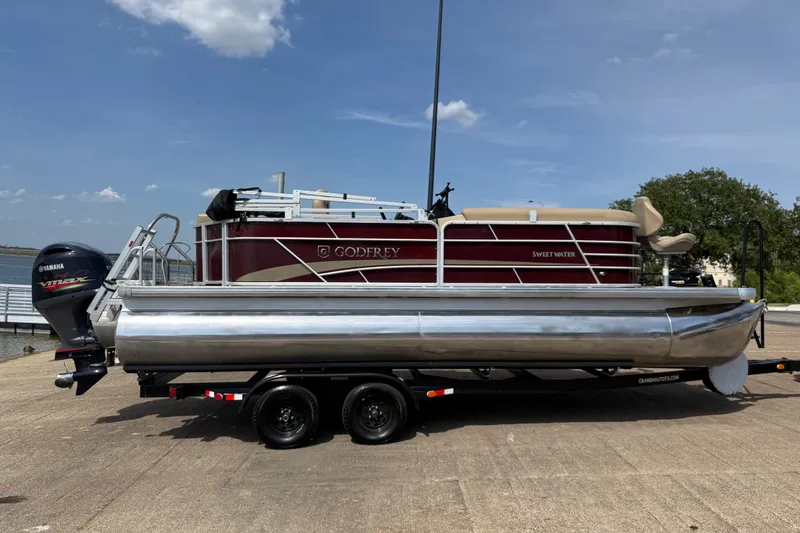 Slide: The Image of 2021 Godfrey Sweetwater 2286 FS pontoon boat on trailer, featuring Yamaha outboard motor. - 15
