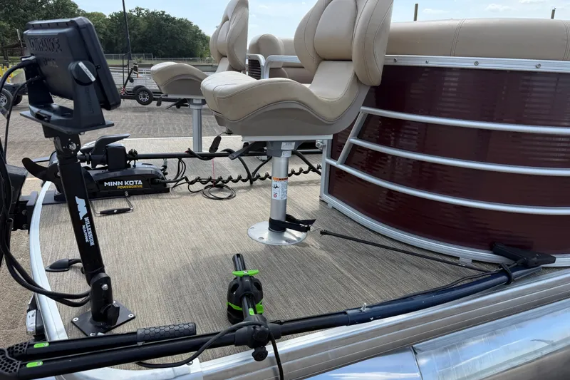 Slide: The Image of 2021 Godfrey Sweetwater 2286 FS boat deck with fishing seats and trolling motor. - 27