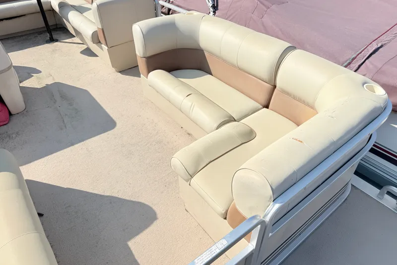 Slide: The Image of 1998 Harris FloteBote 220 Classic pontoon boat with beige seating and spacious deck. - 13