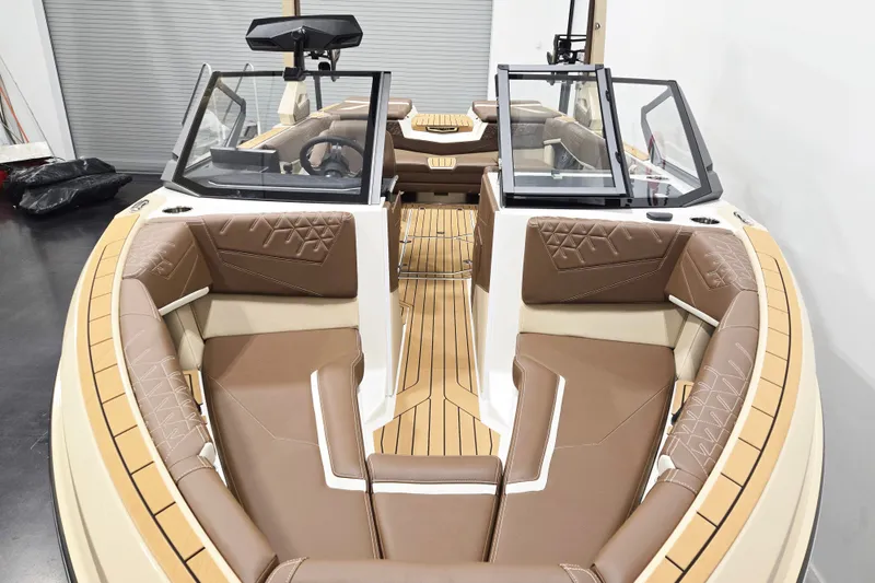 Slide: The Image of The image shows the interior of a 2027 Nautique Super Air Nautique S23 with sleek seating. - 5