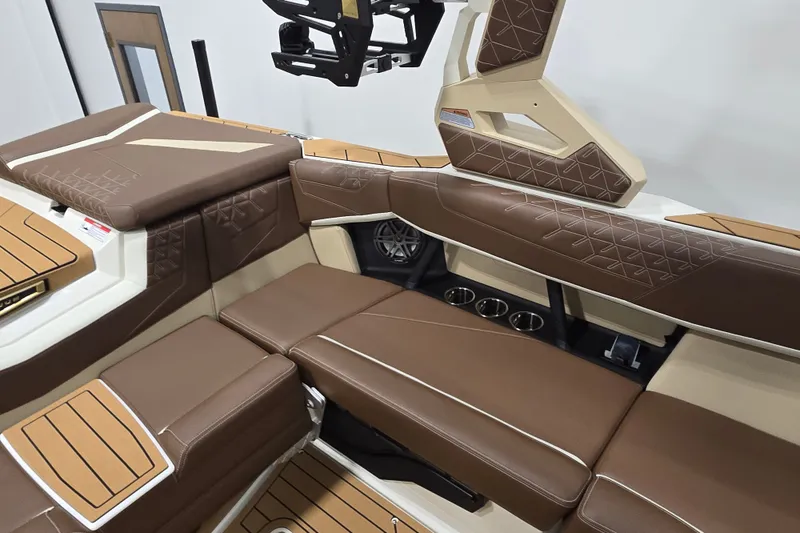 Slide: The Image of The interior of the Super Air Nautique S23 features brown upholstery and modern design elements. - 11