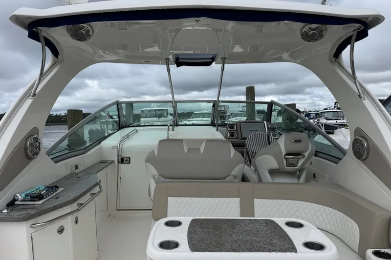 Slide: The Image of 2013 Chaparral 330 Signature boat interior with seating, helm, and dashboard. - 4