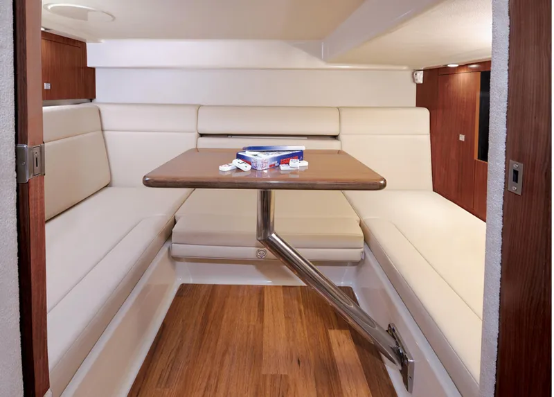 Slide: The Image of Manufacturer Provided Image: 2013 Chaparral 330 Signature cabin interior with dining table and seating. - 31