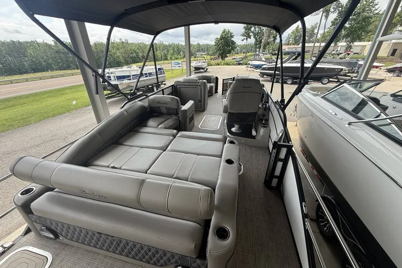 Slide: The Image of 2021 Barletta L25U pontoon boat interior with spacious seating and canopy. - 15