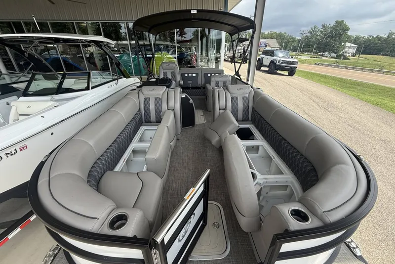 Slide: The Image of 2021 Barletta L25U pontoon boat with spacious seating and modern design. - 6