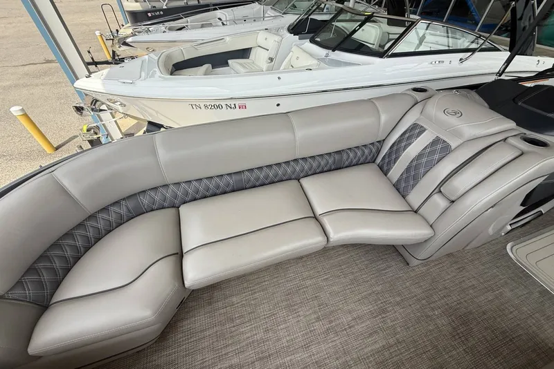 Slide: The Image of Luxurious seating on a 2021 Barletta L25U pontoon boat, featuring elegant upholstery and spacious design. - 7