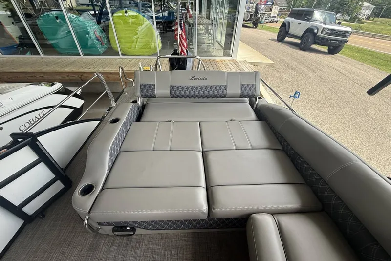 Slide: The Image of 2021 Barletta L25U pontoon boat with spacious seating and modern design. - 12