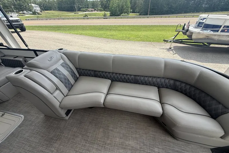 Slide: The Image of Luxurious seating on a 2021 Barletta L25U pontoon boat, featuring elegant gray upholstery. - 8