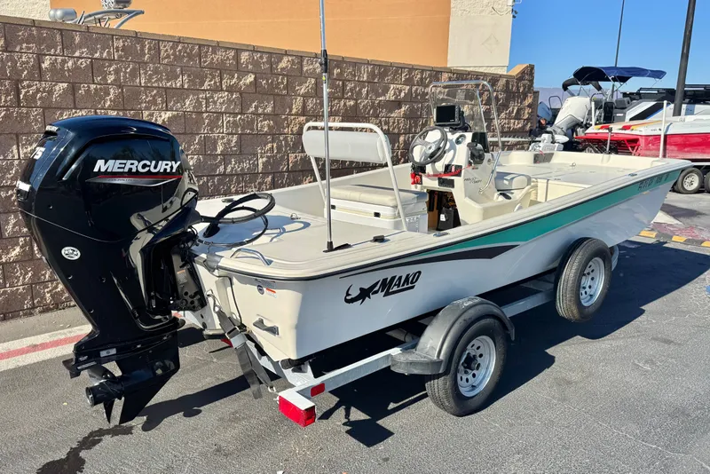 Slide: The Image of 2023 Mako Pro Skiff 17 CC boat with Mercury engine on trailer. - 5