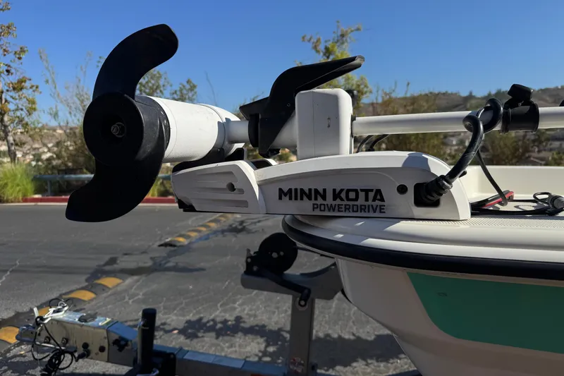 Slide: The Image of Minn Kota PowerDrive motor on 2023 Mako Pro Skiff 17 CC boat, parked outdoors. - 8