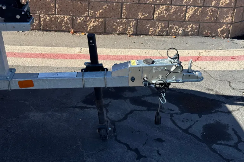 Slide: The Image of Trailer hitch of a 2023 Mako Pro Skiff 17 CC on pavement. - 29