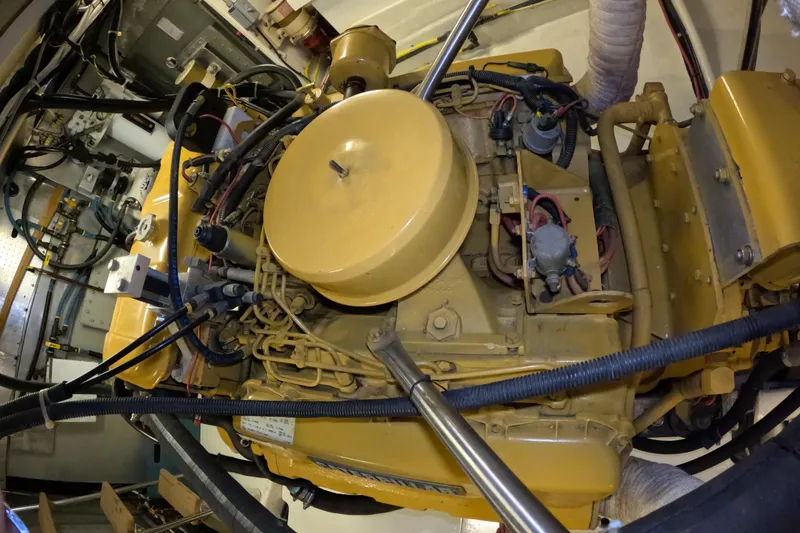 Slide: The Image of Engine room of a 1999 Kadey-Krogen 48 North Sea yacht, showcasing mechanical components. - 94