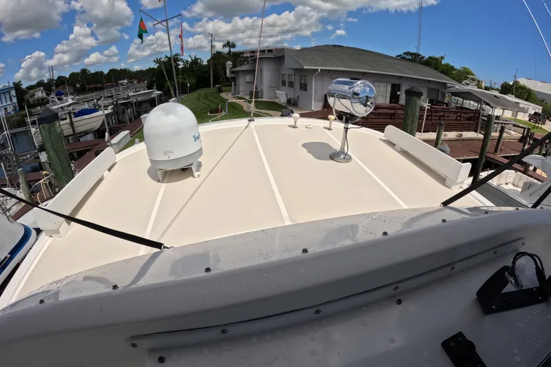 Slide: The Image of Kadey-Krogen 48 North Sea yacht deck, 1999 model, docked with clear sky and marina view. - 70