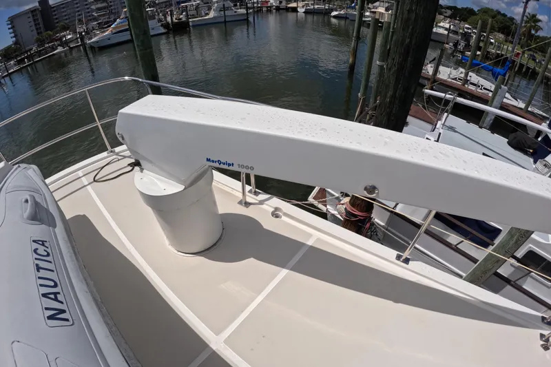Slide: The Image of 1999 Kadey-Krogen 48 North Sea yacht deck with MarQuipt davit and Nautica tender. - 71