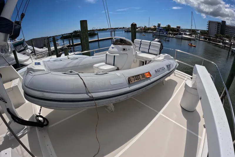 Slide: The Image of Inflatable boat on 1999 Kadey-Krogen 48 North Sea yacht deck, docked at marina. - 73