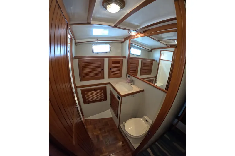 Slide: The Image of Bathroom interior of 1999 Kadey-Krogen 48 North Sea yacht with wooden accents. - 43