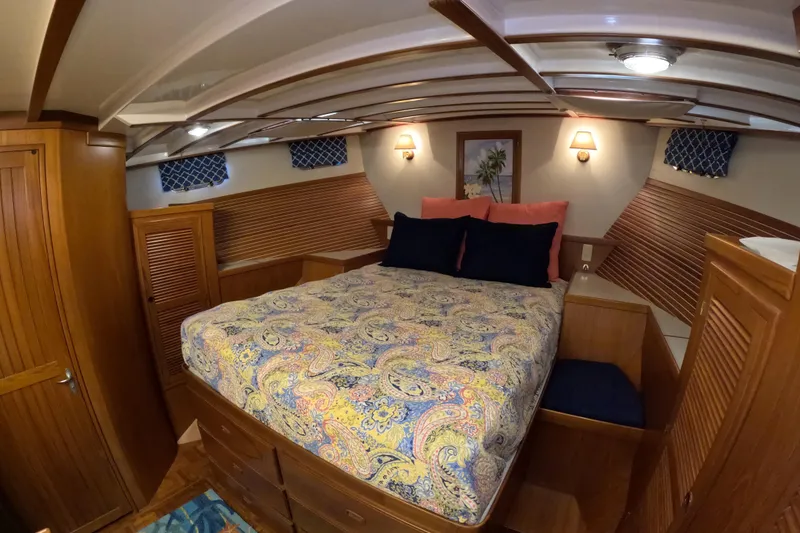 Slide: The Image of Cozy cabin interior of 1999 Kadey-Krogen 48 North Sea yacht with patterned bedding. - 29